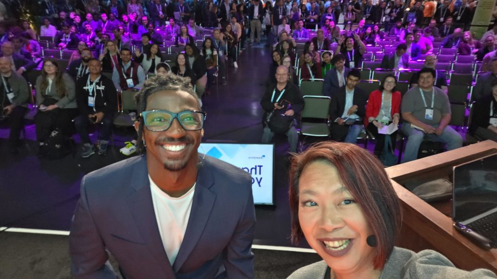 Jennifer and Jeremiah presenting ‘Automate Across Salesforce and Slack’ in the Admin Theater at Dreamforce ’25.]